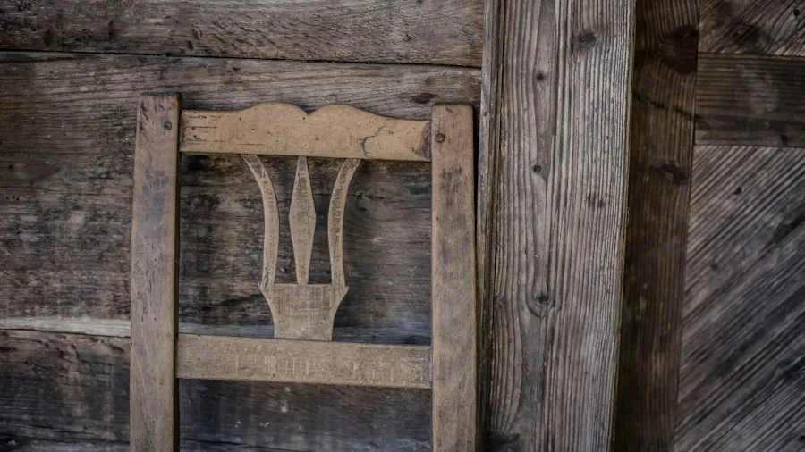 Close-up of solid wood chair frame joints and corner reinforcement showing quality furniture construction